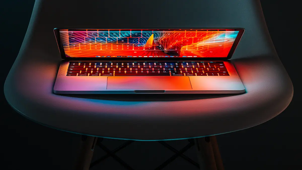 A switched on laptop screen in half open position